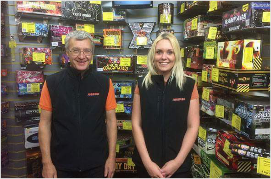 David and Rebecca Stood in Front of Display Fireworks at the Jordans Fireworks Shop